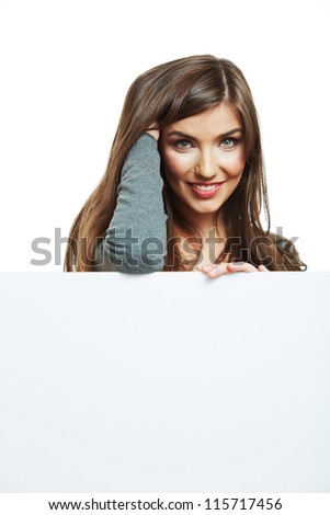 Teenager girl hold white blank paper. Young smiling woman show blank board. Close up female model portrait isolated on white background.