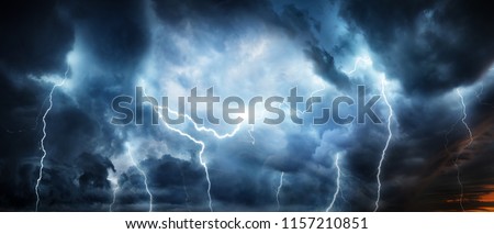 Lightning thunderstorm flash over the night sky. Concept on topic weather, cataclysms (hurricane, Typhoon, tornado, storm)  Royalty-Free Stock Photo #1157210851