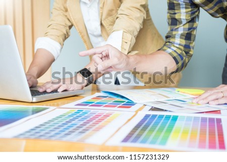 Creative Graphic designer at work. Color swatch samples pantone palette in studio modern office, interior design, renovation and technology concept