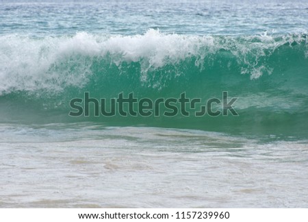 Coastal waves are caused by strong winds that blow in the daytime. copy space for text.background