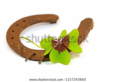 Old horseshoe with lucky clover