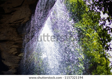 Waterfall in tropical forest at So Da Cave Temple in Thailand.