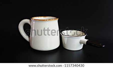 White classic coffee mug with milk pitcher.