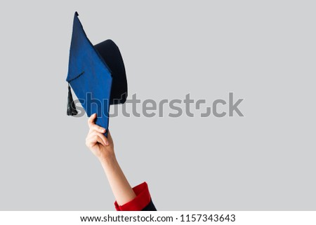 Graduate student rising up her cap