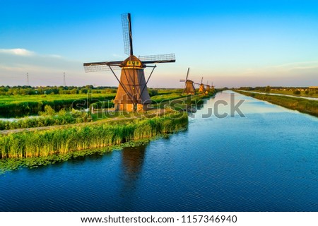 Aerial view of traditional windmills in Kinderdijk, The Netherlands. This system of 19 windmills was built around 1740 and is a UNESCO heritage site.