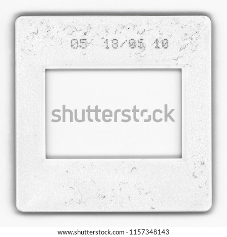 Old fashioned 35mm film frame with signs of usage, Real high-res 35mm photo dia slide scan isolated on white background.