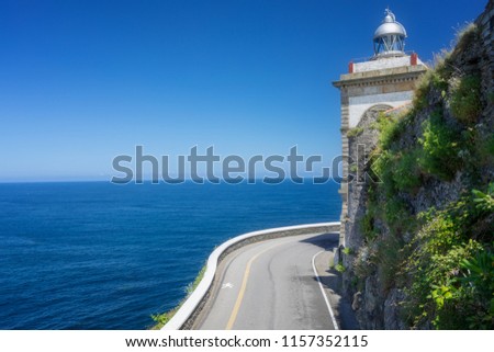 The road to the sea and lighthouse. Asturias. Spain.