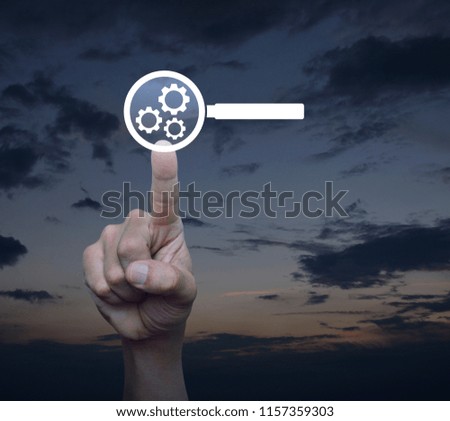 Hand pressing seo flat icon over sunset sky, Technology and internet earch engine optimization concept