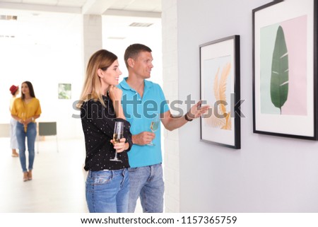 Couple at exhibition in art gallery