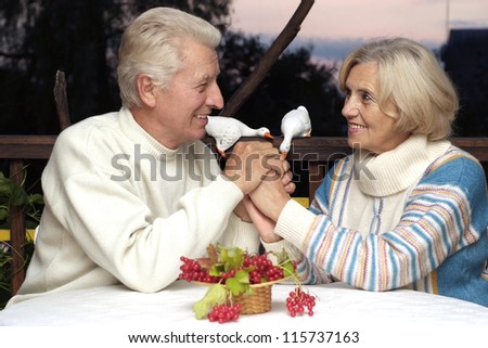 happy beautiful old people are sitting at the table