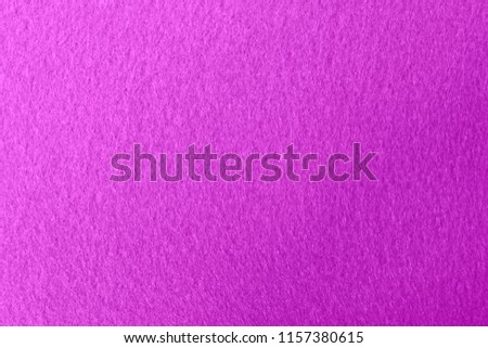 Purple - violet felt background. Surface of fabric texture.