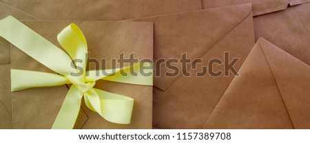 Banner for website, envelopes tied with ribbon on wooden background, concept message, holiday