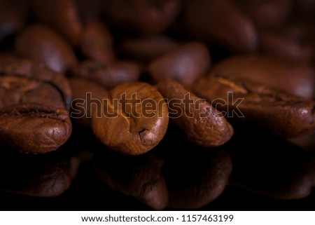 Close-up brown coffee beans macro photography.
