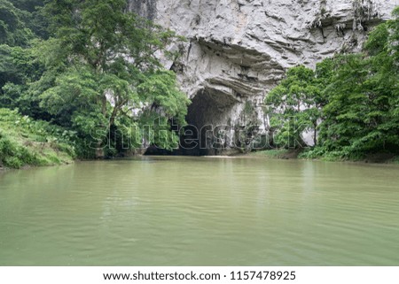 Beautiful natural scenery of Phong cave with boat tour at Ba Be Lake Nation Park is a famous travel destination in Bac Kan province, Vietnam.