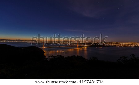 Picture of the Golden Gate Bridge in San Francisco with light reflections taken at sunrise in February 2015