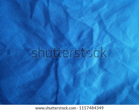 synthetic blue cloth have thin and wrinkled, closeup fabric background