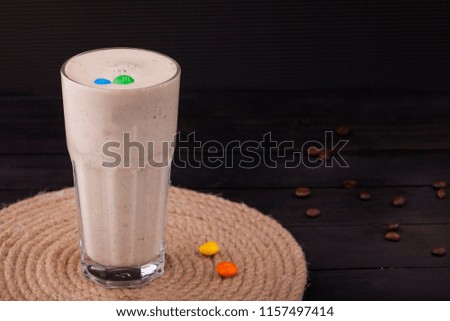 latte with caramel and candies  