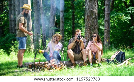 Halt for snack during hiking. Company friends relaxing and having snack picnic nature background. Camping and hiking. Company hikers relaxing at picnic forest background. Spend great time on weekend.