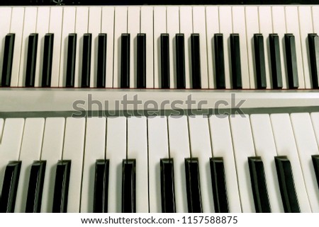 Piano keys. Top view of black and white piano keyboard background. Abstract background. Close-up.