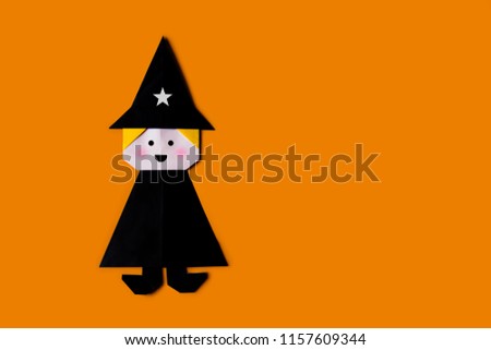 Origami for kids : collection of gentleman wizard from folded paper on orange background isolated.Top view, flat lay.Easy to use for card.Happy halloween.