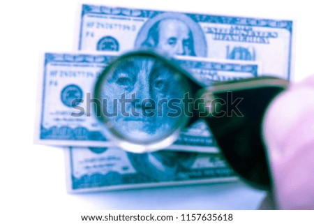Souvenir hundred-dollar bills. Through the prism