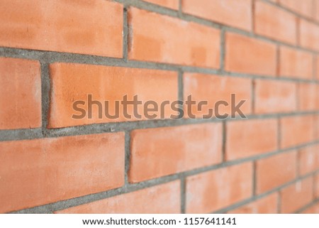 piece of a brick wall from a red brick