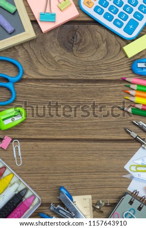 Ideal for back to school, education and  office work background concept. School supplies, stationery accessories on wood background. Top view with copy space.
