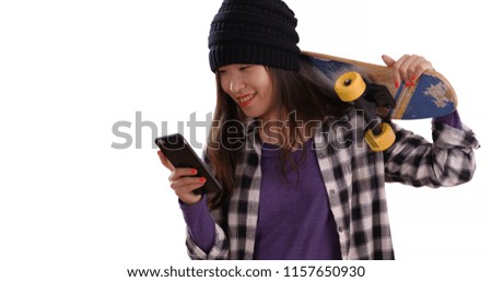 Happy millennial skater taking selfie with skateboard isolated on white