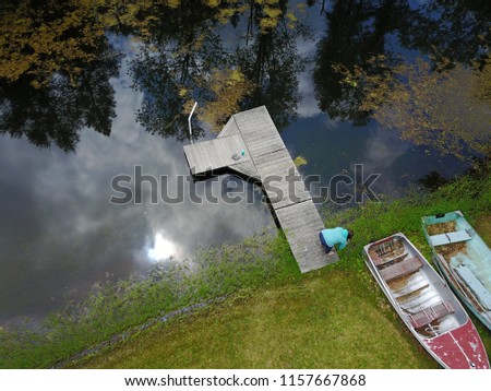 Aerial View of Pier, Pond and Row Boats In Rural Wisconsin