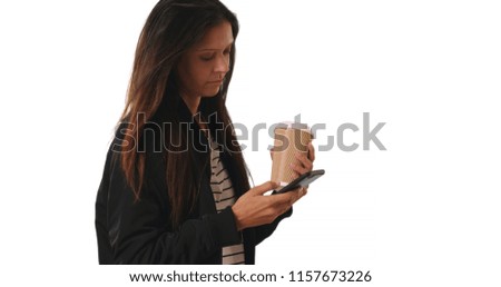 Hipster girl in bomber jacket with coffee text messaging on white background