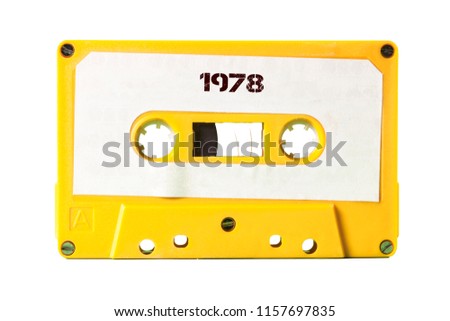 A vintage cassette tape from the 1980s era (obsolete music technology) with the text 1978 printed over it (my addition, not in the original image). Color: happy bright yellow. White background.

