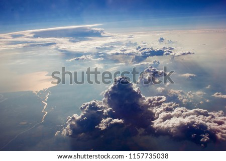 Awesome clouds from window of the plain Royalty-Free Stock Photo #1157735038