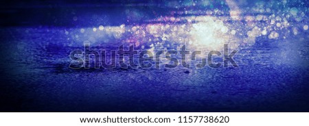 Empty scene of a show with lanterns and concrete floor, blue abstract background with bokeh, lights, rays. Wet asphalt with reflection of lights, rain