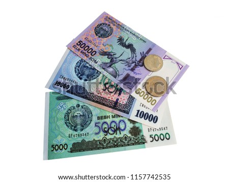 
 Photo of coins and banknotes of Uzbekistan from a collection isolated on white background