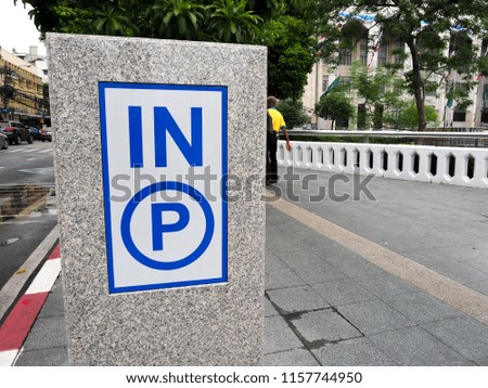 In sign,entrance sign to parking lot,in symbol