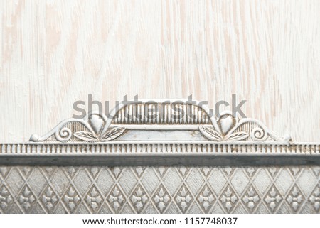 Wooden background with an iron frame