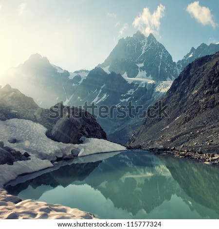 scenery of high mountain with lake and high peak Royalty-Free Stock Photo #115777324