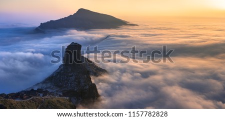 Fangjingshan, Sea of Clouds, Sunset above the Clouds at Mount Fangjing Nature Reserve - Guizhou Province, China. Summit in the clouds. UNESCO World Heritage List, China National Parks Royalty-Free Stock Photo #1157782828