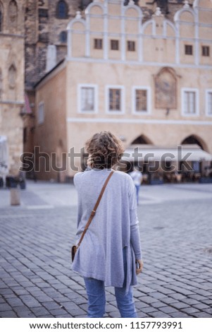 Tourism in Europe, a woman is walking around the city. Prgue, Czech Republic 