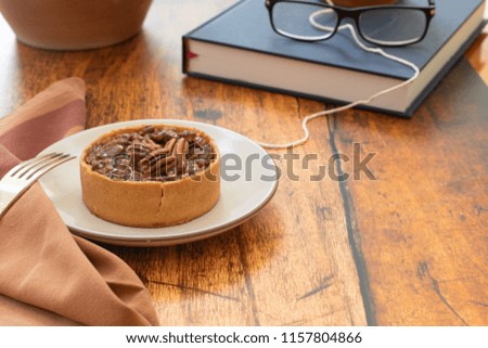 Eating a pecan tart while study