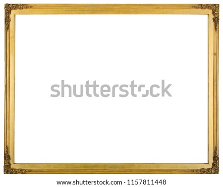 An antique gold coloured wooden picture frame isolated on a white background.