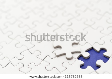 Plain white jigsaw puzzle. (Mount in dark blue)