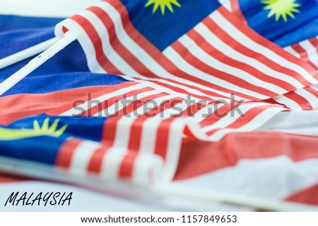 Malaysia's Independence day concept with malaysian flag and text MALAYSIA. Celebration on 31st August Hari Merdeka for Malaysian country.