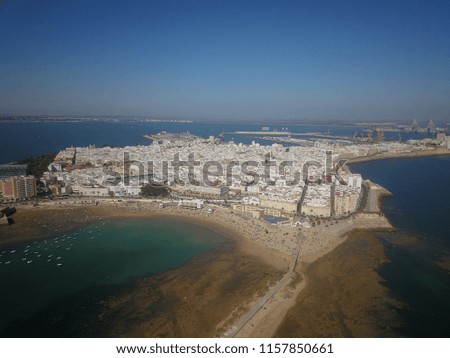 Aerial drone image of the famous beach city Cadiz in the South of Spain with the famous beach Playa La Caleta on a sunny day.