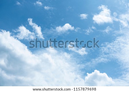 Dramatic blue sky with fluffy clouds texture background.