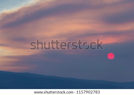 Wild Fire Smoke Sunset with Red Sun