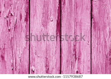 Old grunge wooden fence pattern in pink tone. Abstract background and texture for design.