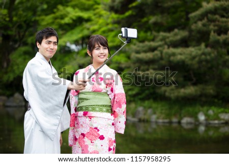 Japanese couples take a picture in Selfie stick　