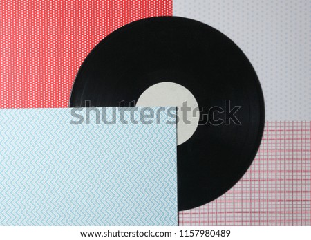 Vinyl plate on a creative background, top view
