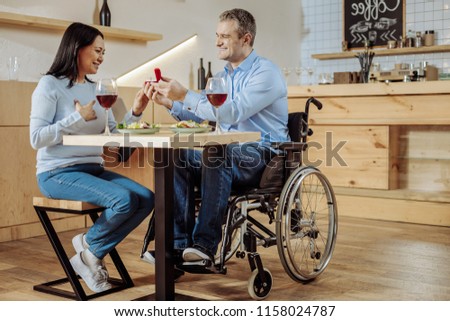 Be brave. Attractive disabled man making a serious decision while sitting in a restaurant